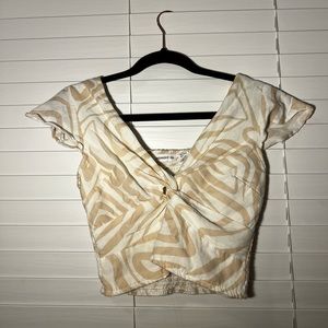 white and cream print shirt